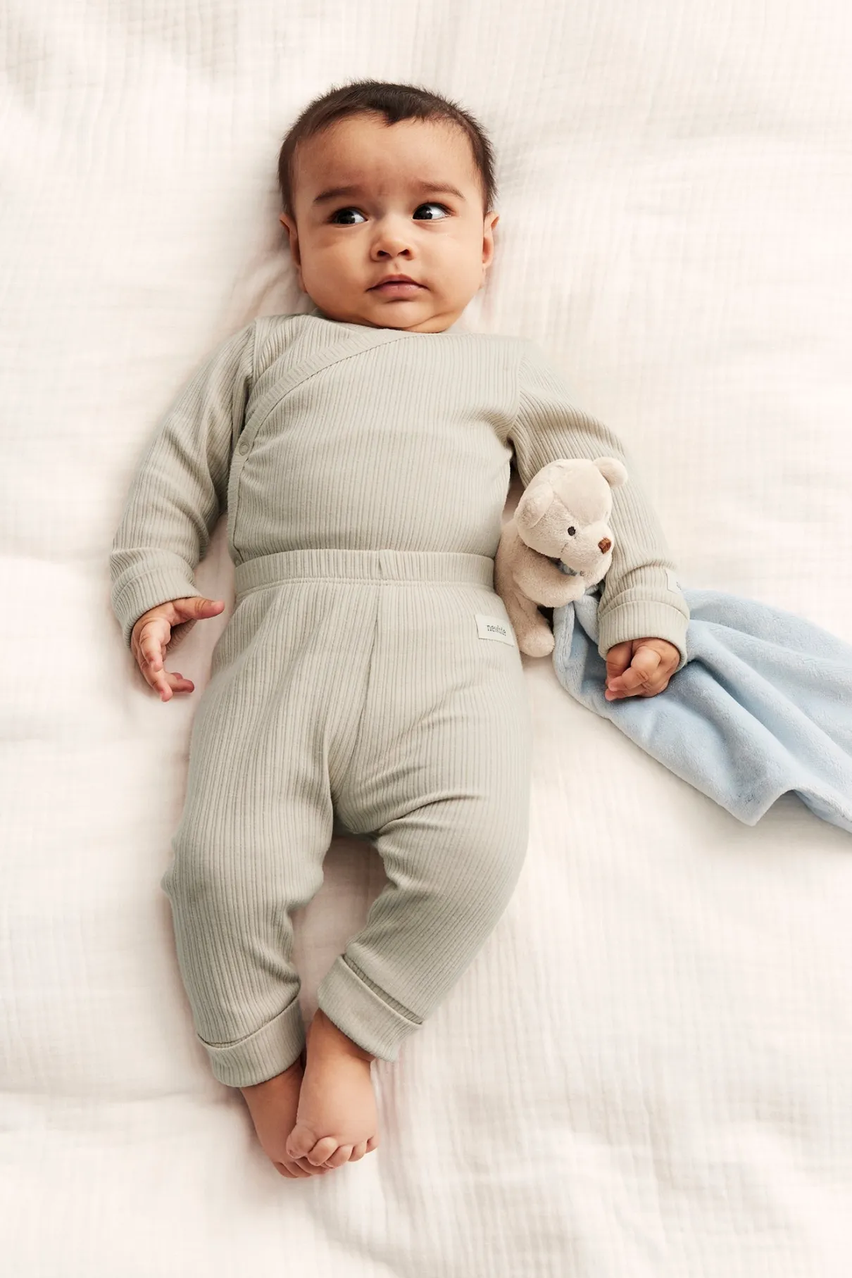 Baby beige ribbed bodysuit with extender