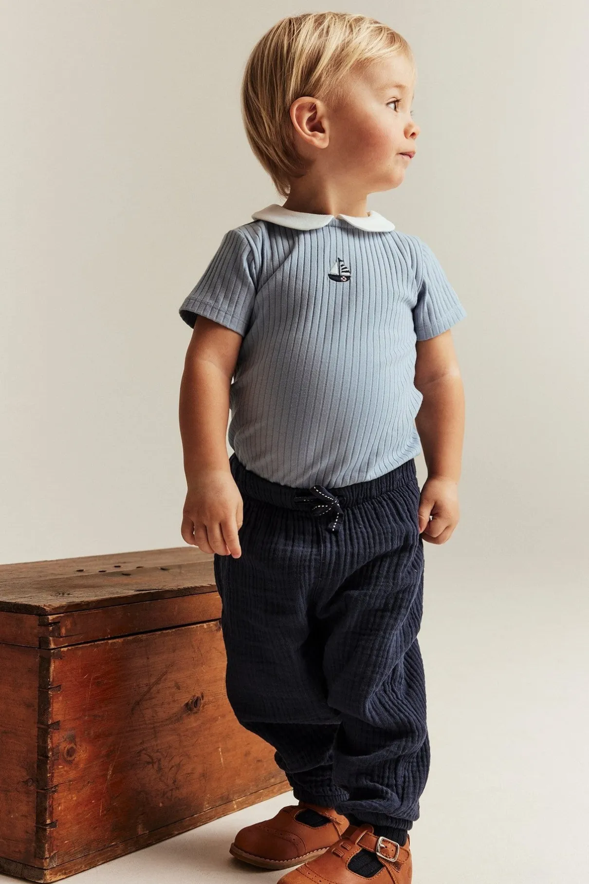 Baby blue bodysuit with sailboat