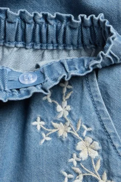 Baby blue denim trousers with floral embroidery