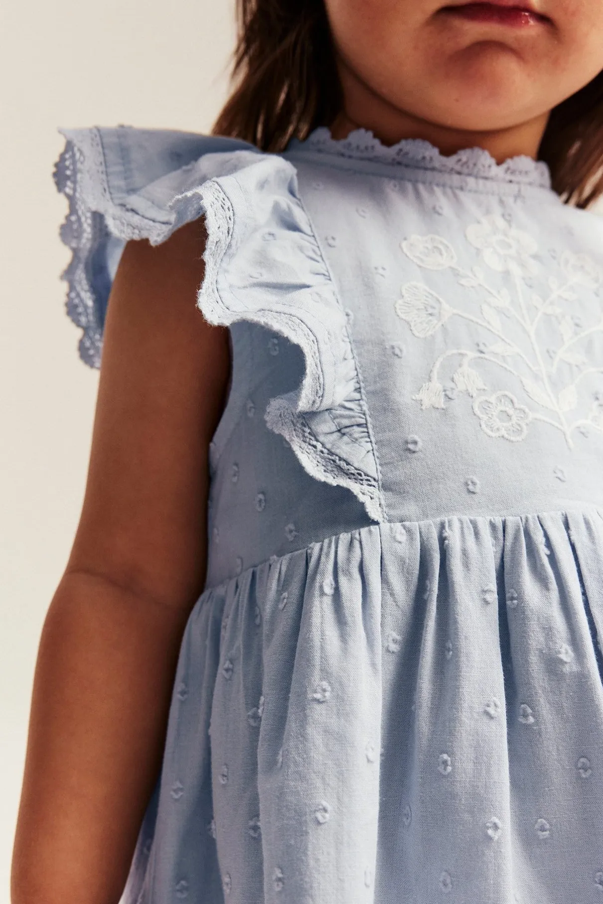 Baby blue dress with floral embroidery