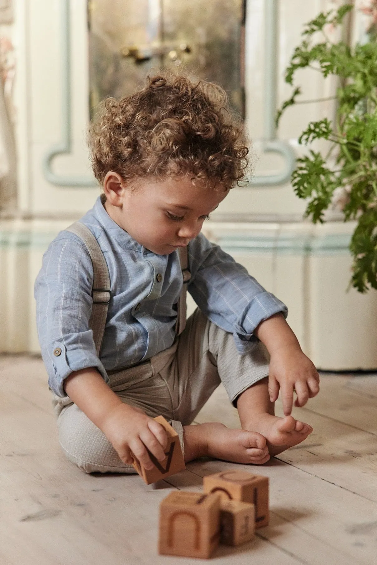 Baby blue striped shirt‑style bodysuit