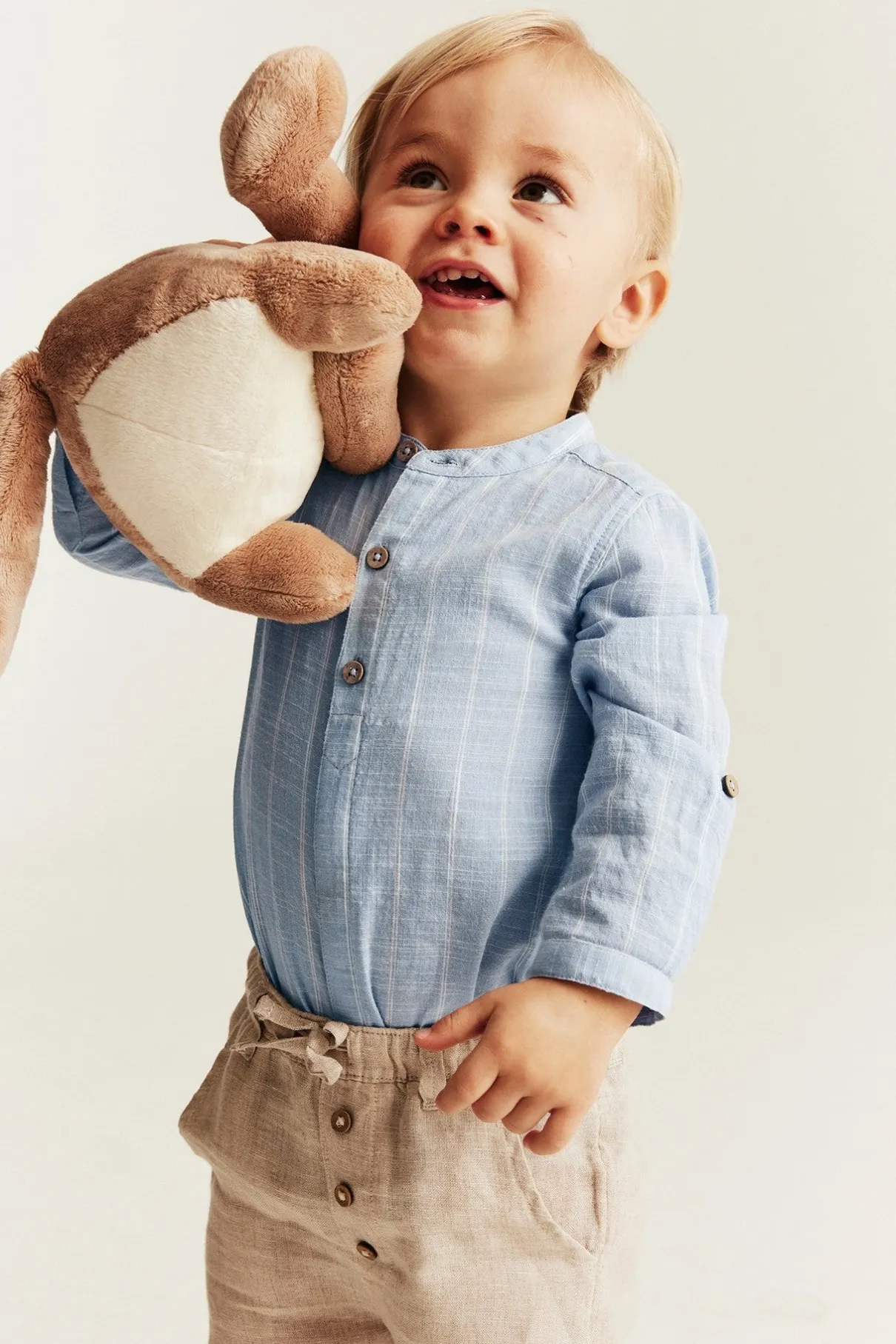 Baby blue striped shirt‑style bodysuit