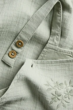 Baby dungarees with lace frill