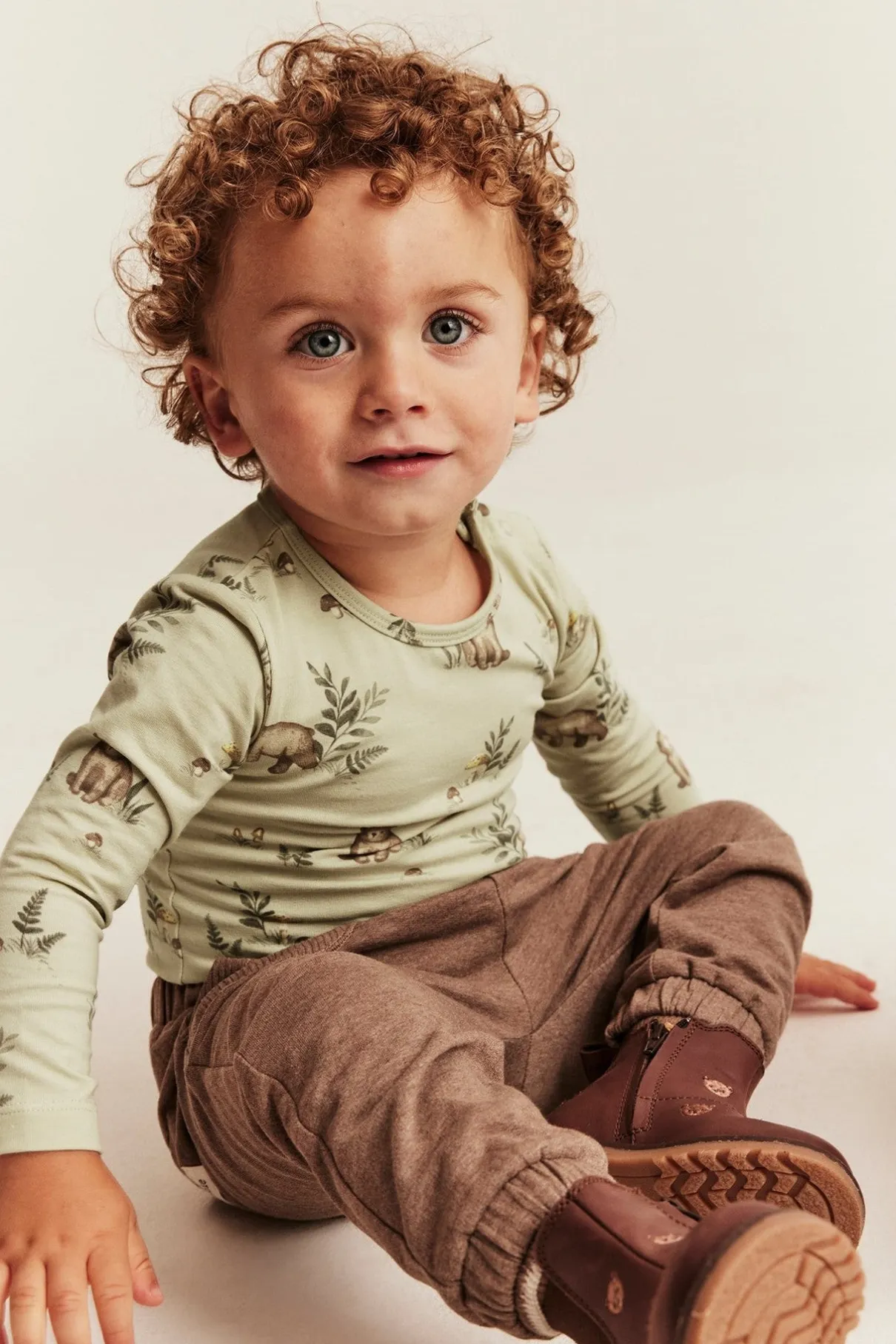 Baby green bodysuit with bear print