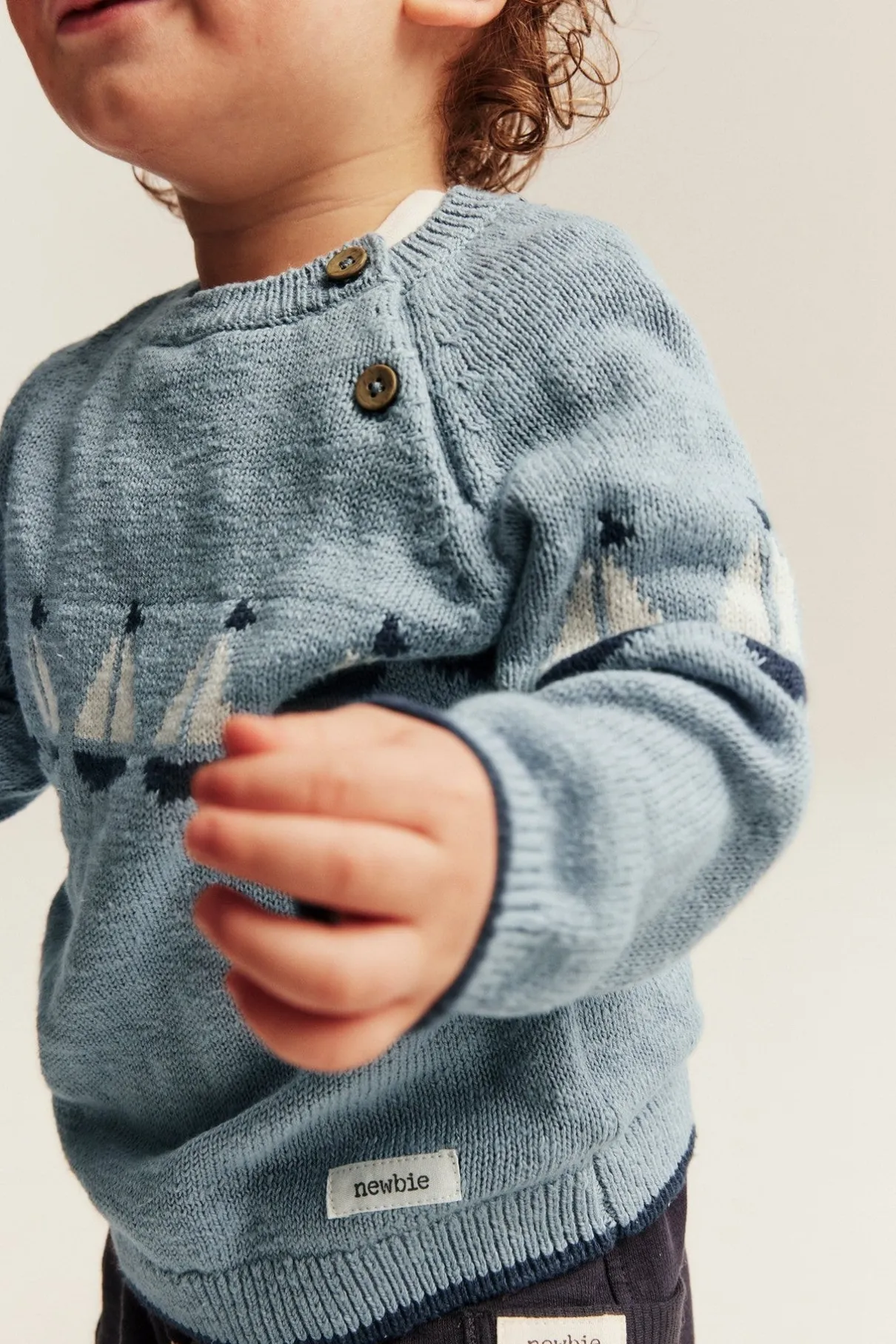 Baby knitted sweater with sailboats
