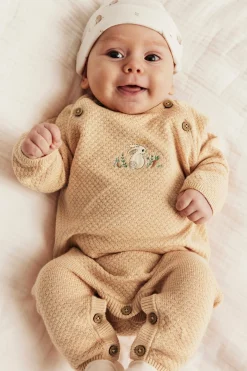 Baby orange knitted jumpsuit with embroidered rabbit