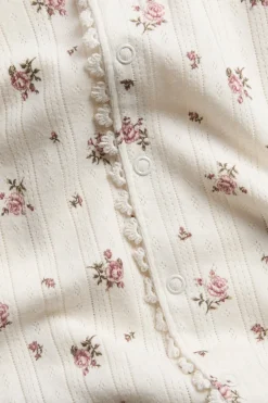 Baby pyjamas with rose pattern