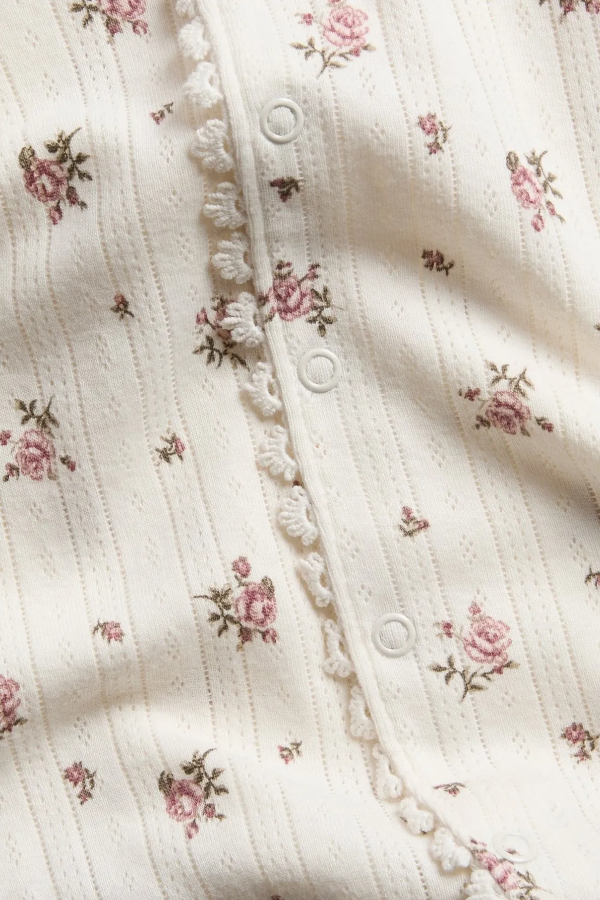 Baby pyjamas with rose pattern