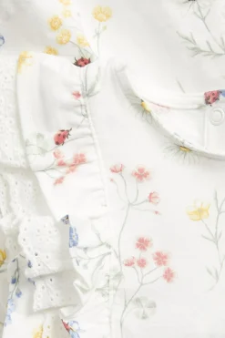 Baby white jersey dress with frill