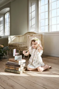 Baby white jersey dress with frill