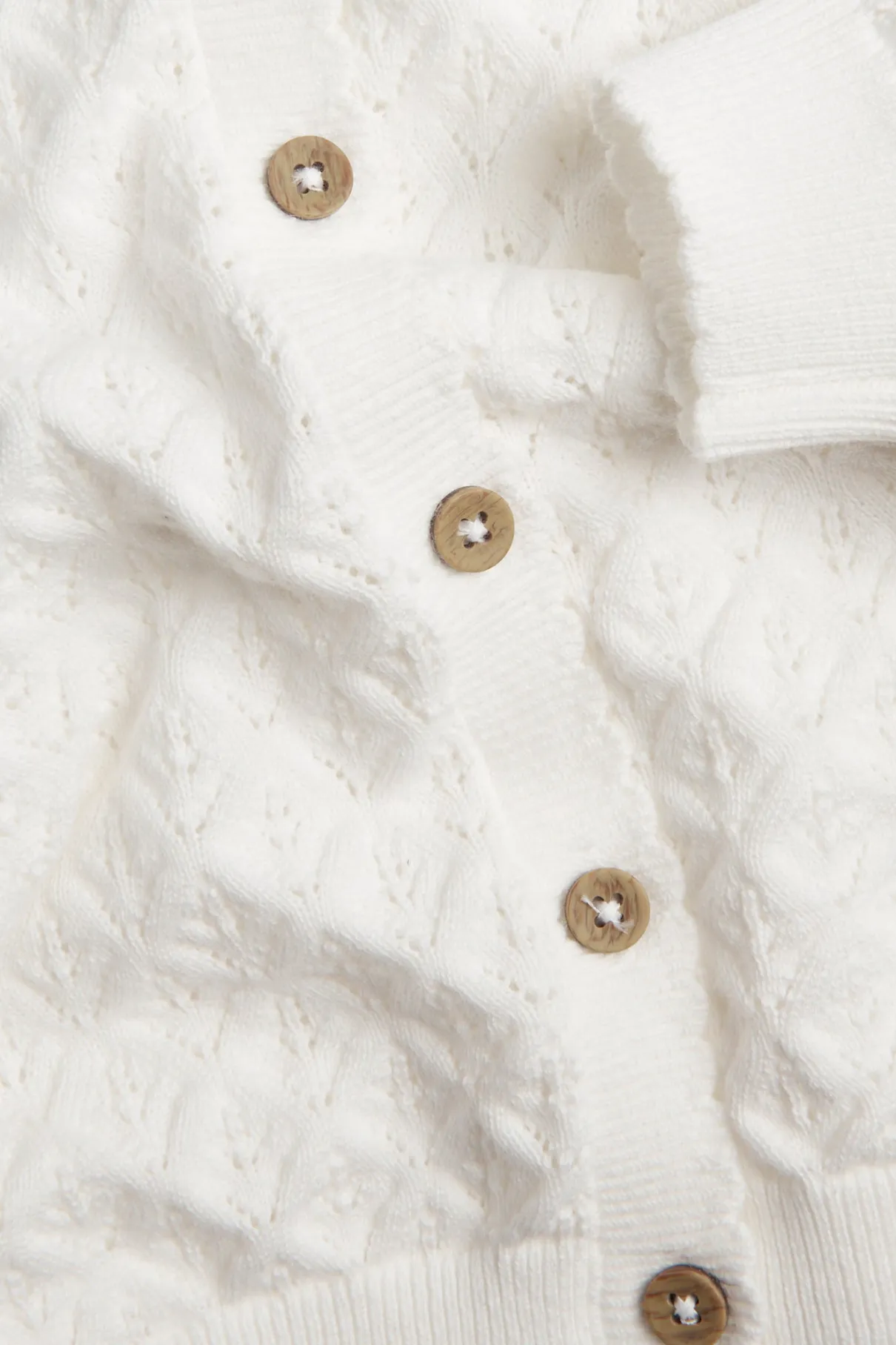 Baby white pattern‑knitted cardigan