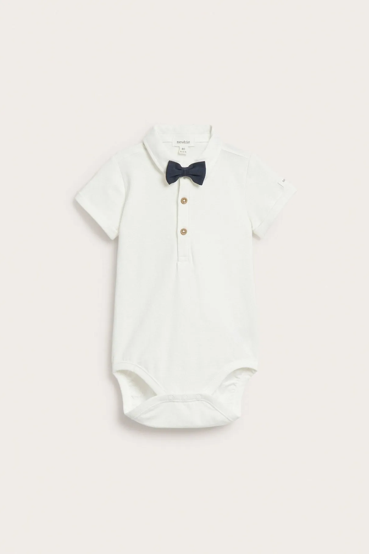 Baby white short-sleeved bodysuit with bow tie