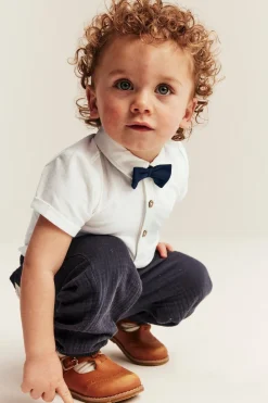 Baby white short-sleeved bodysuit with bow tie