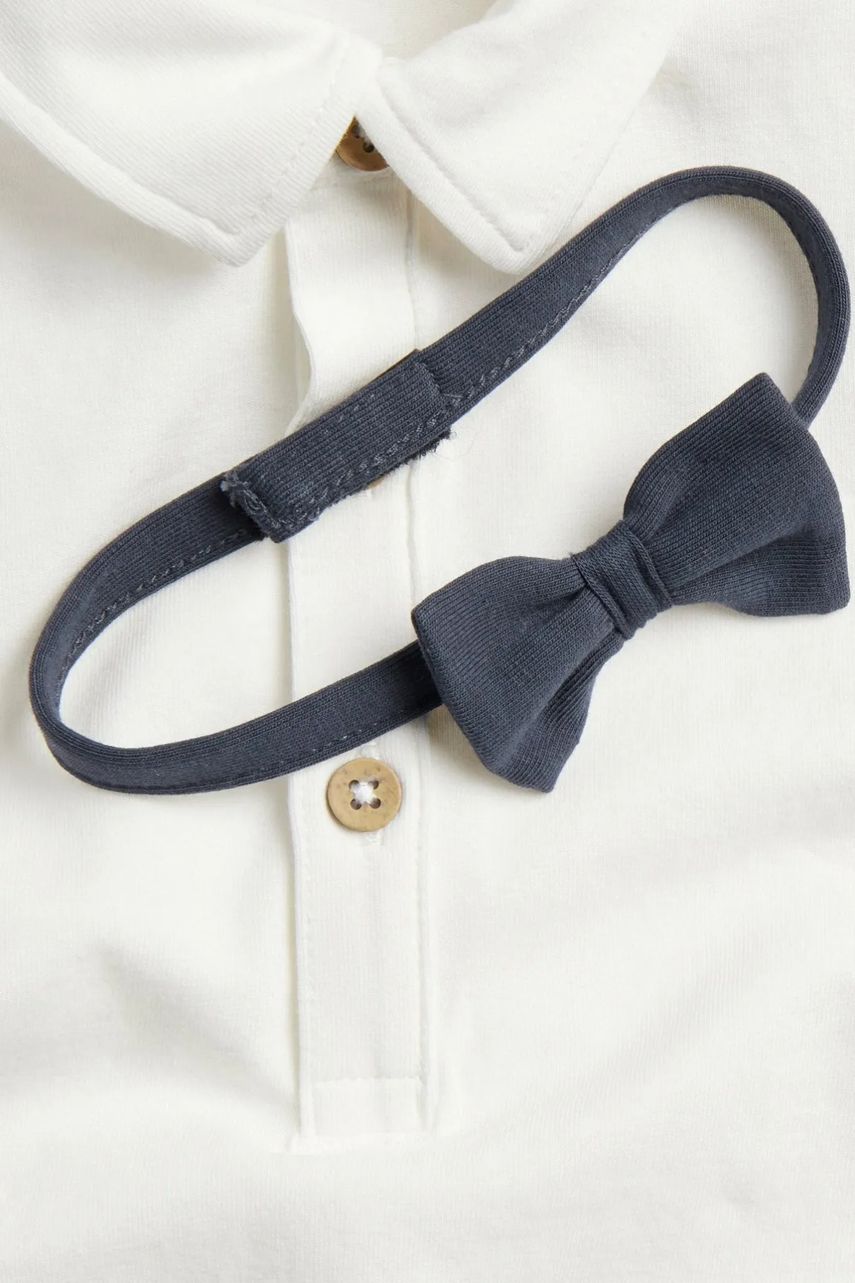 Baby white short-sleeved bodysuit with bow tie