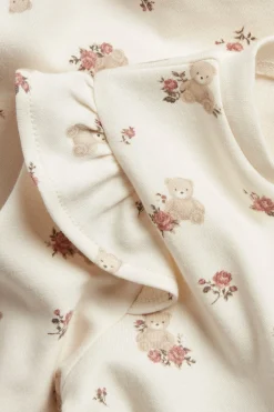 Baby white sleepsuit with teddy bears and roses