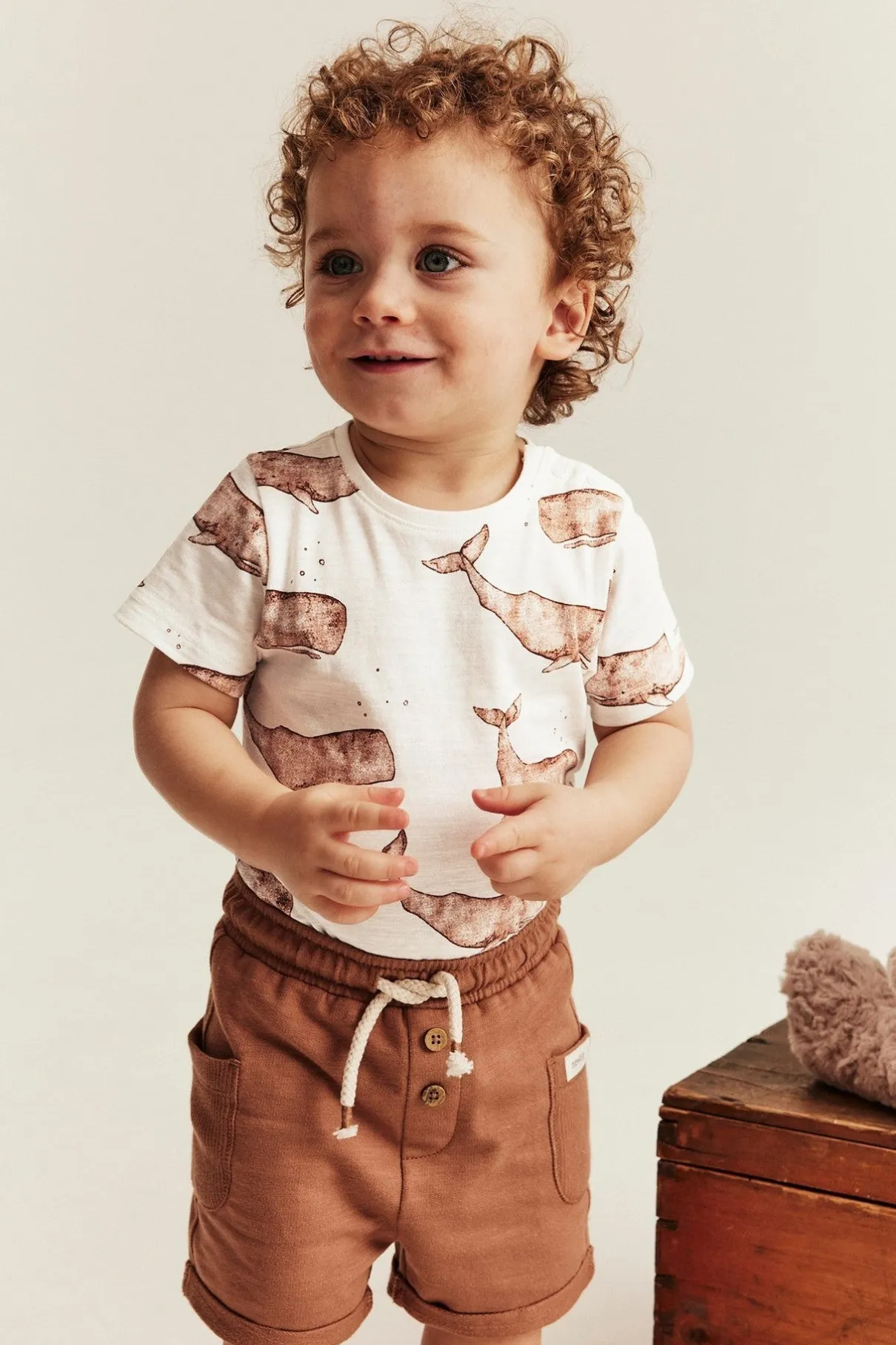 Baby white whale‑print bodysuit