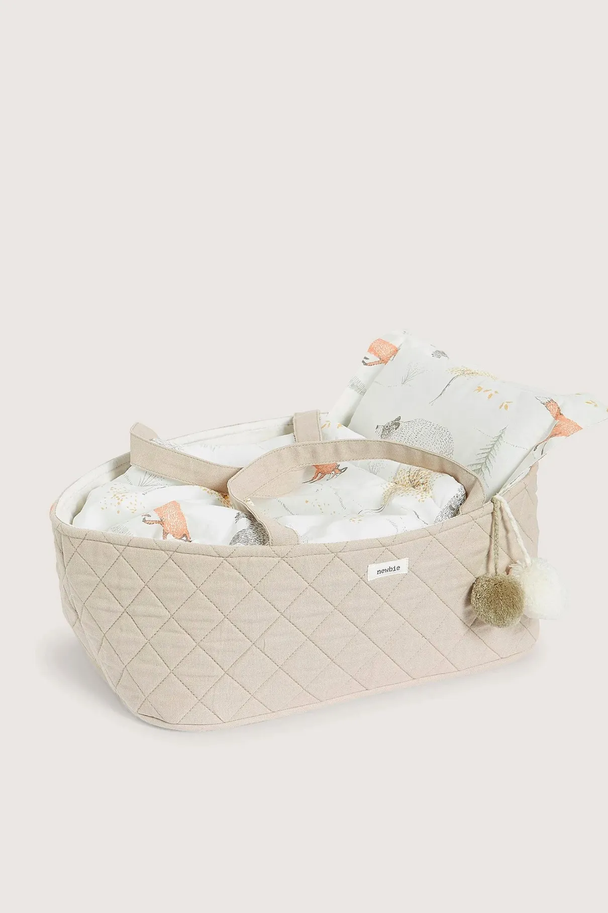 Beige quilted doll basket