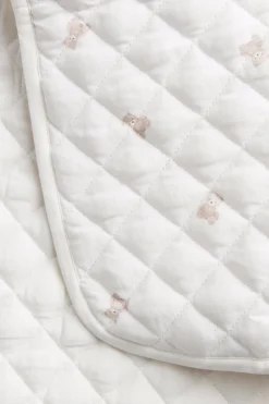 Foldable white changing mat with teddy bears