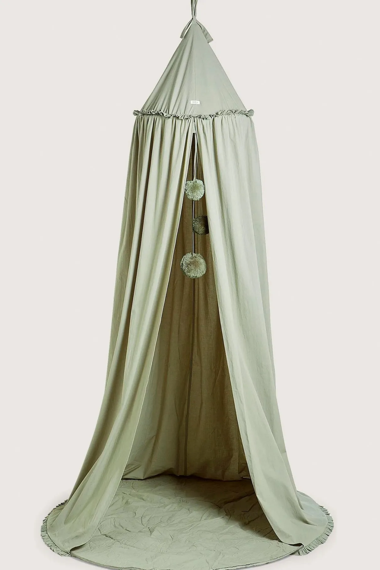 Green reading tent with pom-poms