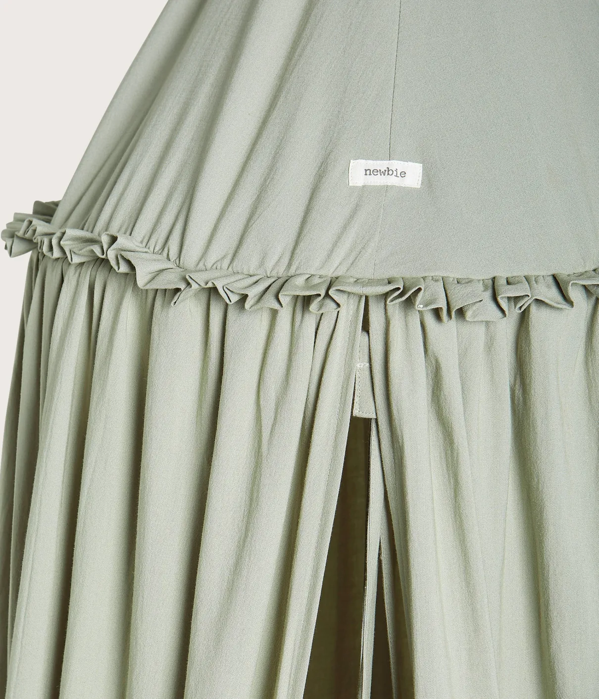 Green reading tent with pom-poms