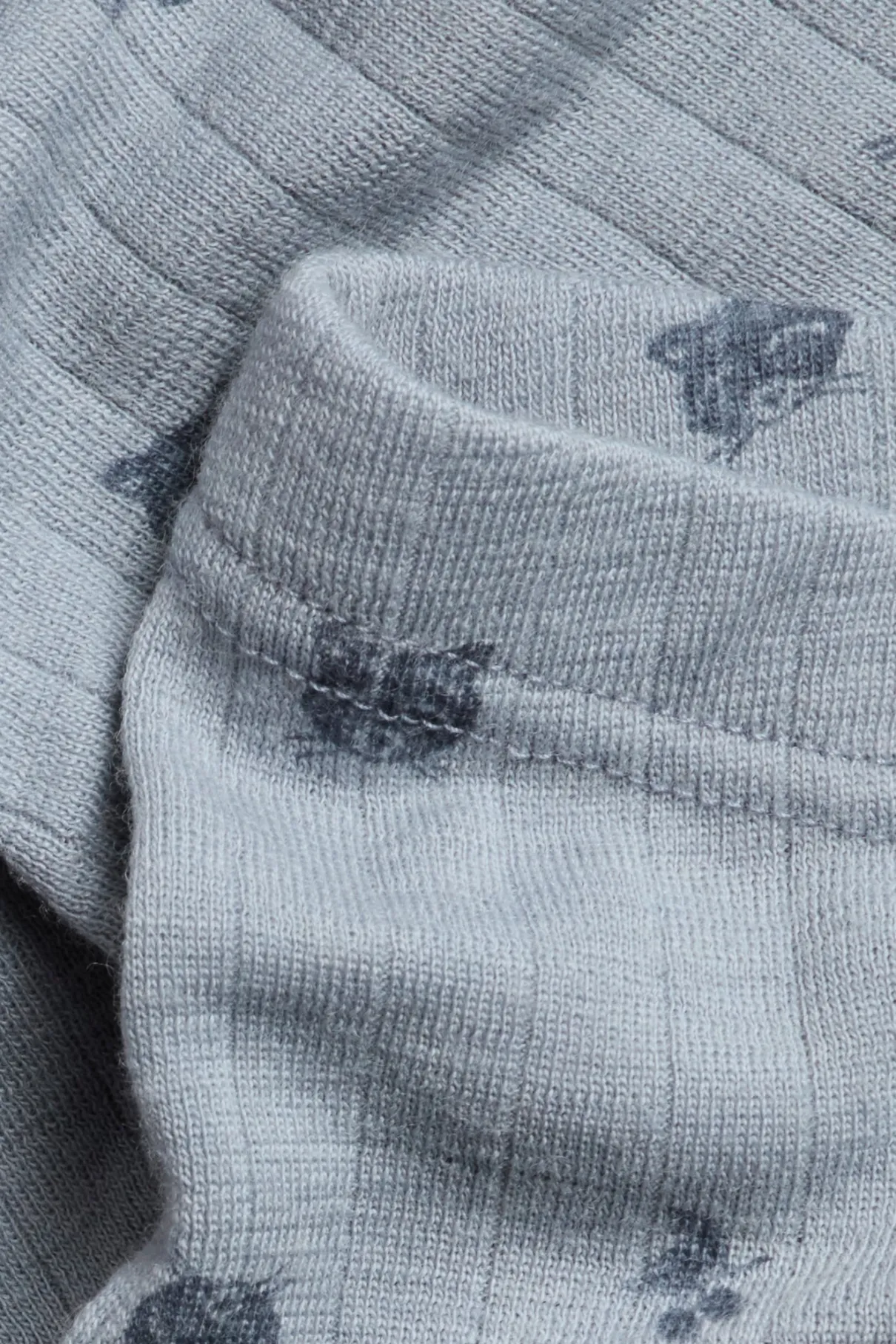 Kids´ blue merino wool leggings with raccoons