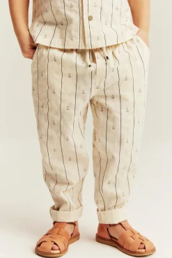 Kids cream striped trousers with sailboats