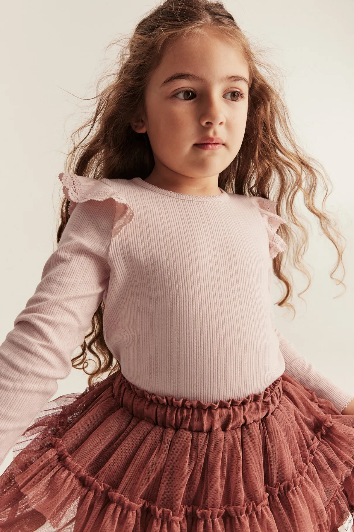 Kids' pink ribbed top with frills