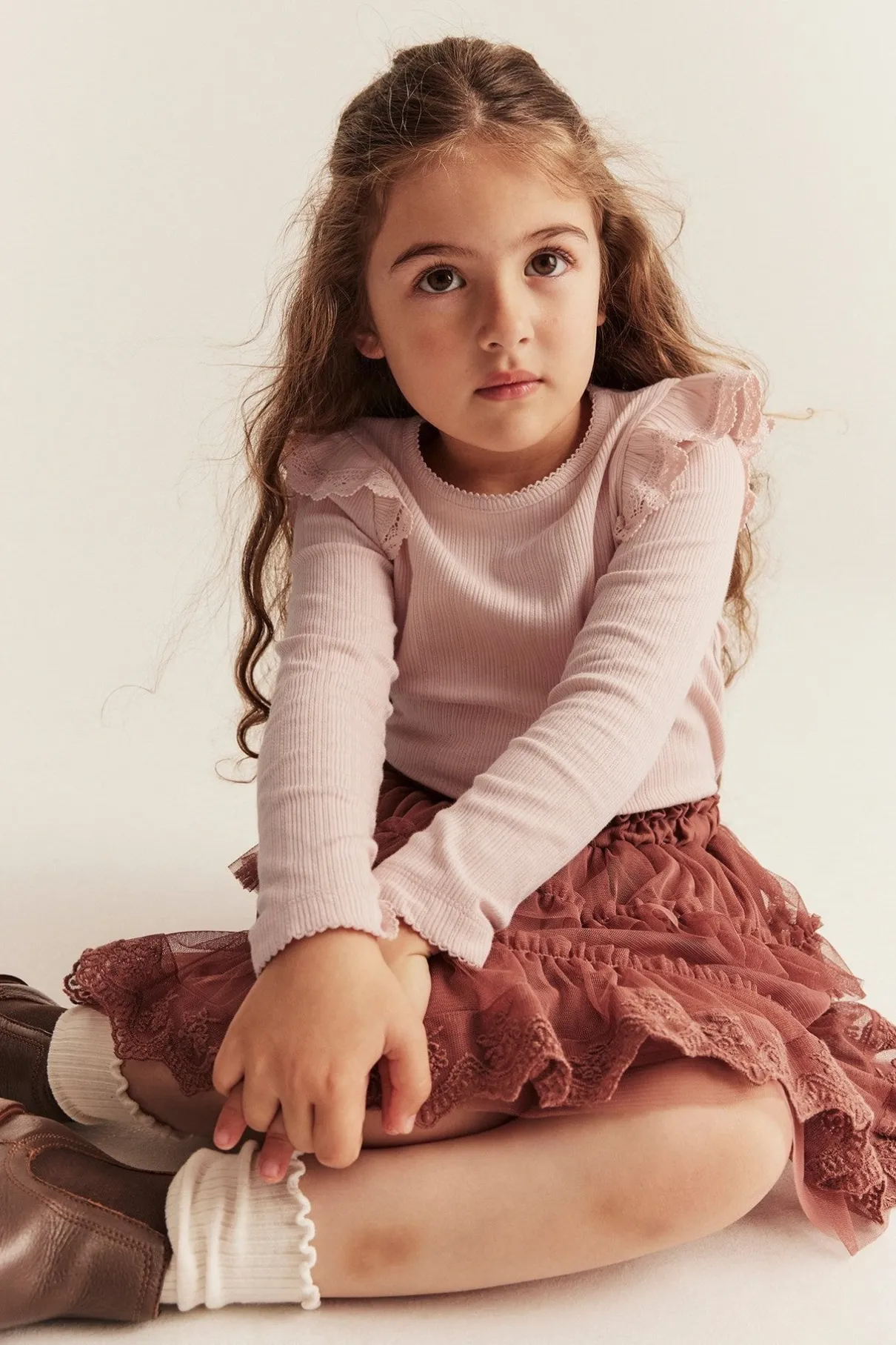 Kids' pink ribbed top with frills