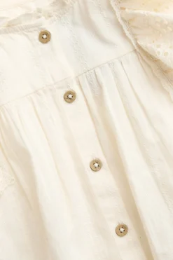 Kids' white blouse with embroidered frills