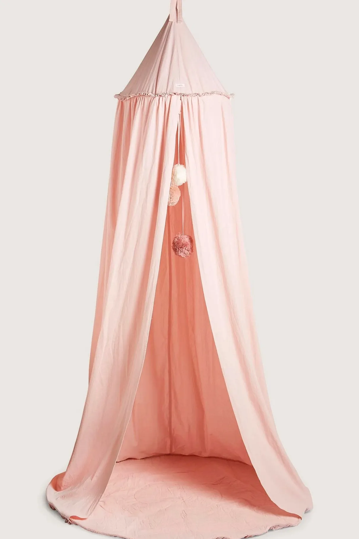 Pink reading tent with pom-poms