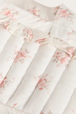 White floral quilted basket for dolls