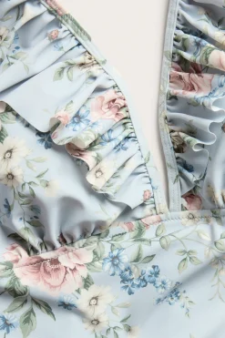 Women's blue floral swimsuit with frill detail