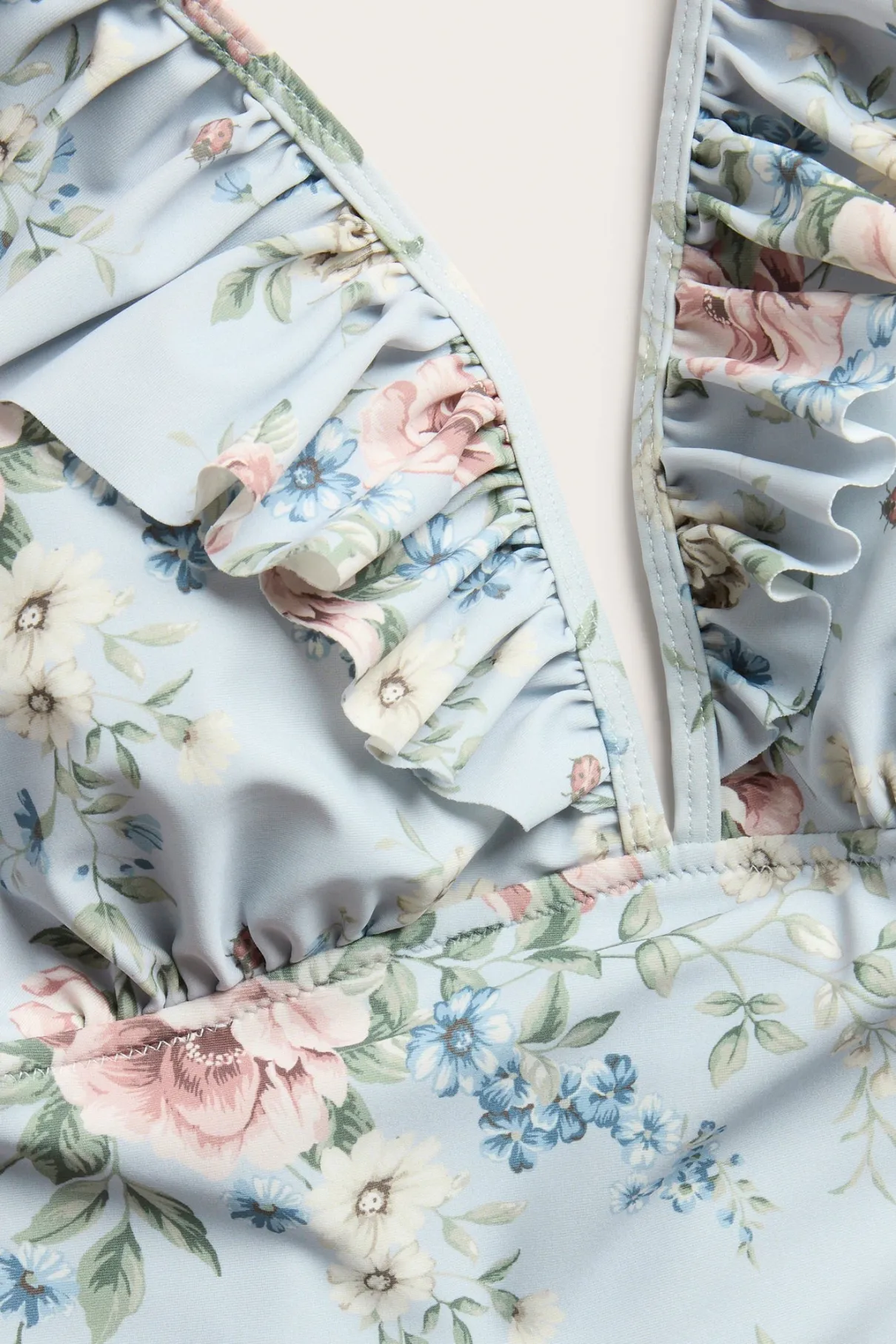Women's blue floral swimsuit with frill detail